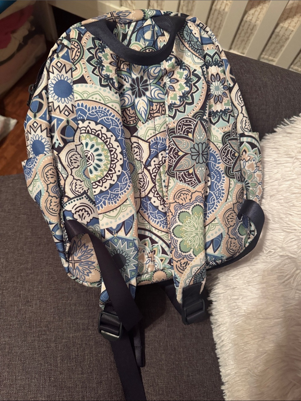 Patterned backpack on couch - Picture 2 of 3